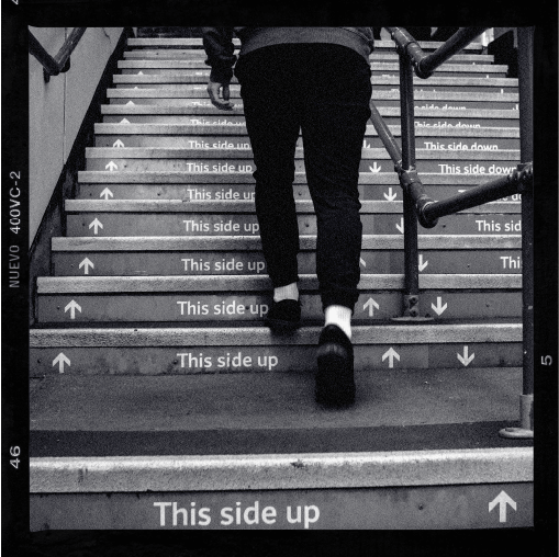 A person walking up a flight of stairs.